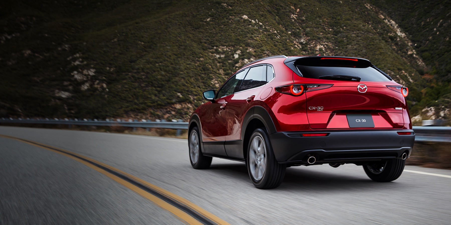 Red 2020 Mazda CX-30 Driving on the road | Mazda of South Charlotte in Pineville, NC