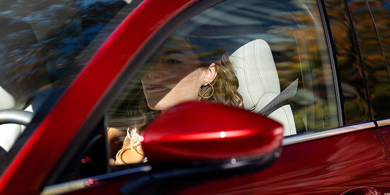 Woman focused on driving a 2020 Mazda CX-30